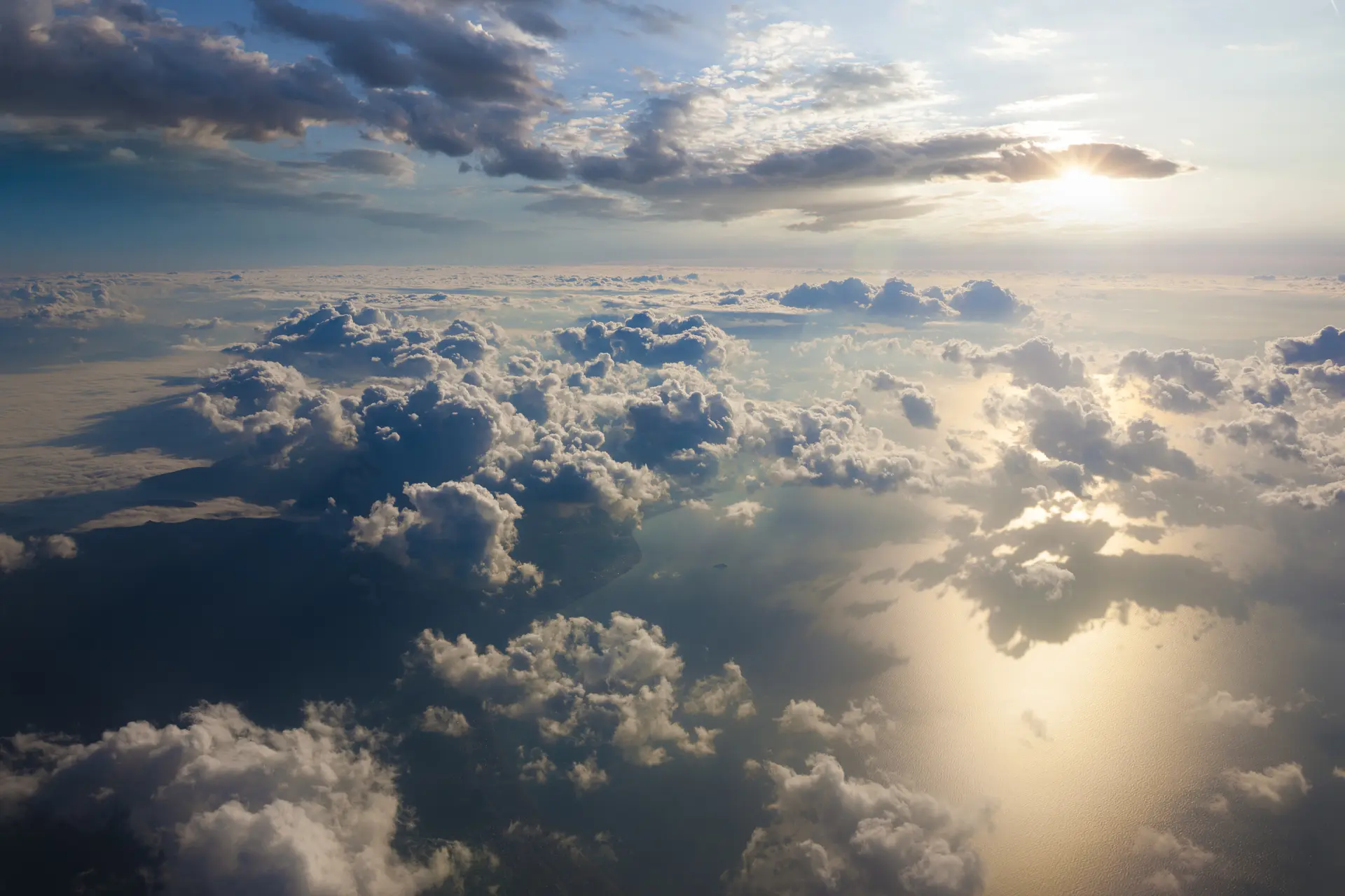 arial photo of sunset through clouds